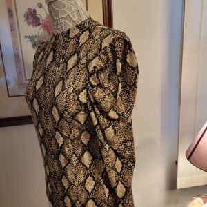 Wild Love turtleneck with snakeskin print.